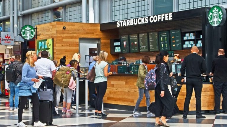 Can Starbucks resolve the issue of long lines at its airport locations?